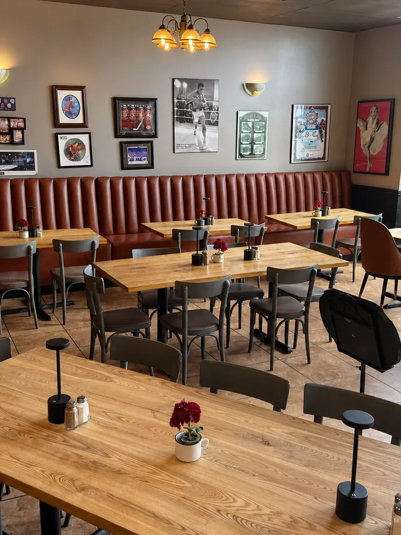 Wooden tables and burgundy seating